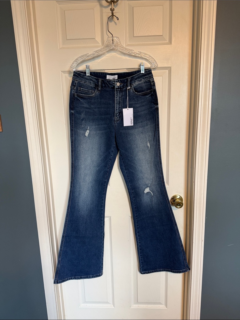 High-Rise Dark Blue Flare Jeans with Subtle Distress